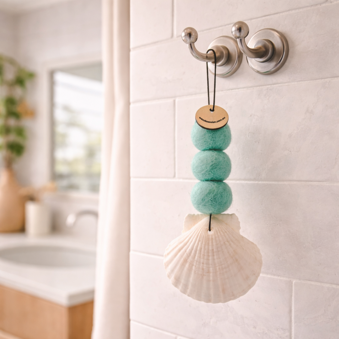 Teal seashell air freshener in laundry space for a crisp clean fragrance